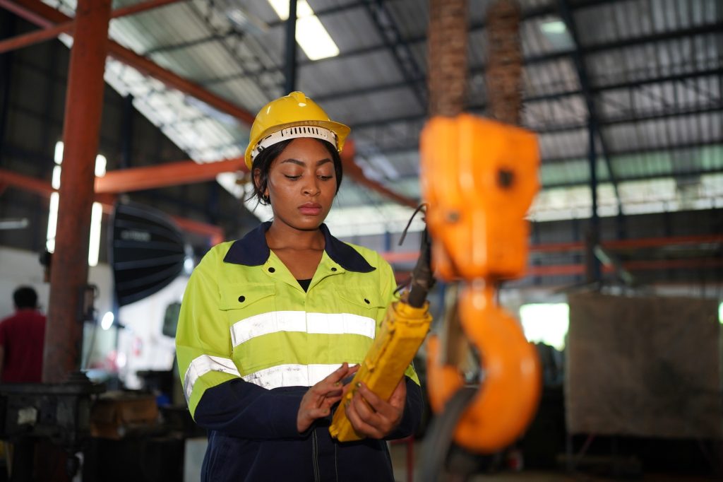 Metal industry worker at factory, Business industry and lathe background.